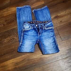Rock Revival Blue Boot Cut Jeans with Faded Design